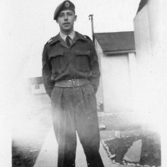 In the Royal Air Force in battledress (normal working uniform)