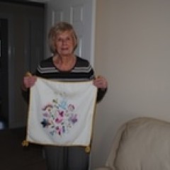 Evelyn with a cushion that she made