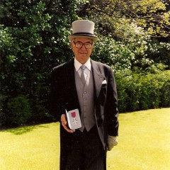 Henry receiving his MBE 1999