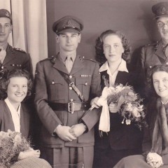 Wedding photograph with Judith's girlfriends from the Interpreters' service, Harold's colonel and his army friends