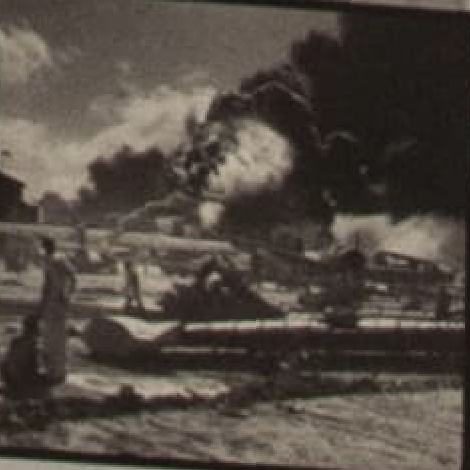 Black and white photograph of thick black smoke rising from burning ships at Pearl Harbor.